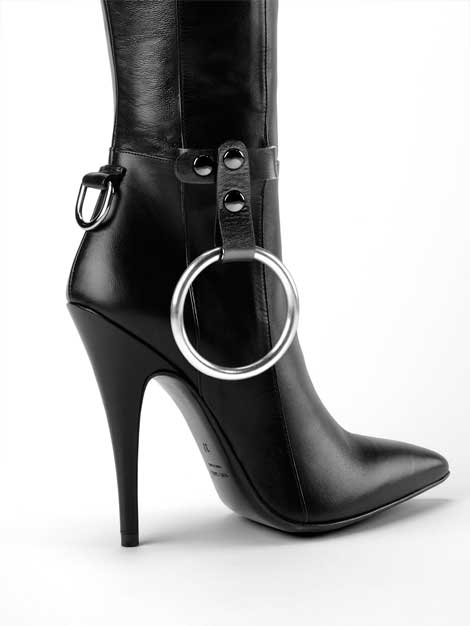 Detail of Absolutely Boot Dominatrix boot in black with cockring holster accessory and cockring ready for kinky games.
