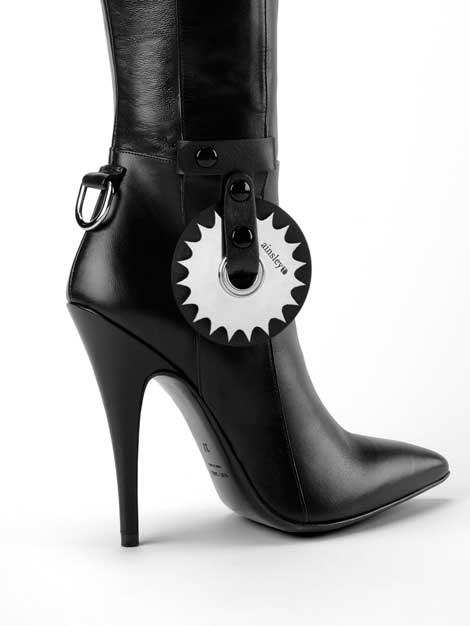 High-heeled Dominatrix boot with daring kinky pinwheel accessory