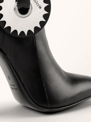 A dominatrix boot which comes with a variety of daring accessories