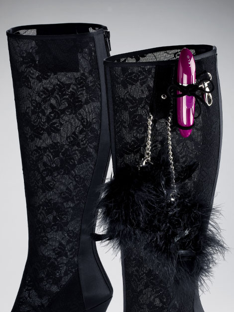 The high-heeled bedroom boot features attachments for bedroom toys like cuffs, whips and vibrators