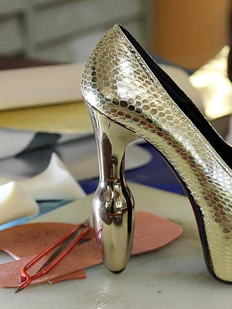 Glossy smooth tall buttplug heel in metallised gold heel finish