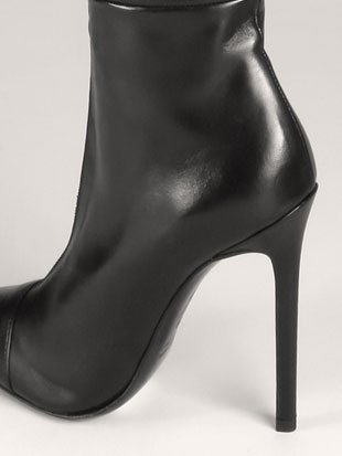 A slimline crotch boot on a 12cm heel with a zipper than runs from behind the toes all the way up the thigh