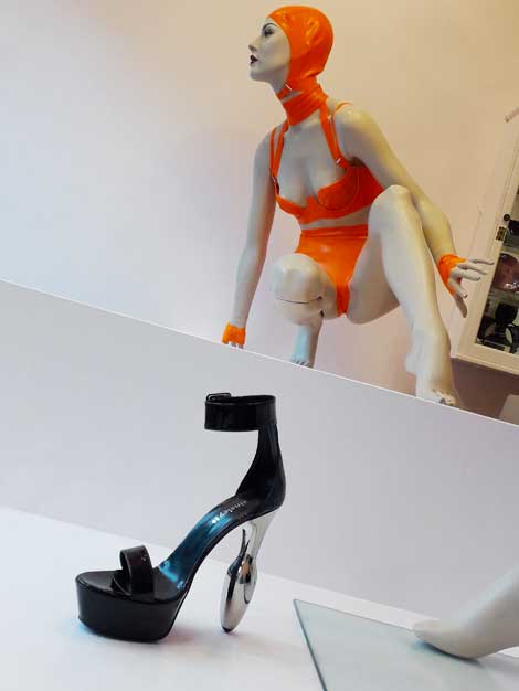 The England Star chrome buttplug heel sandal on show at the Atsuko Kudo couture latex fashion show, London