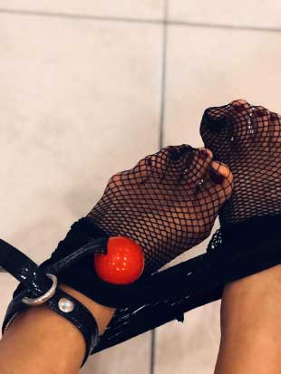 Kinky foot play with fishnet nylons and ball gag
